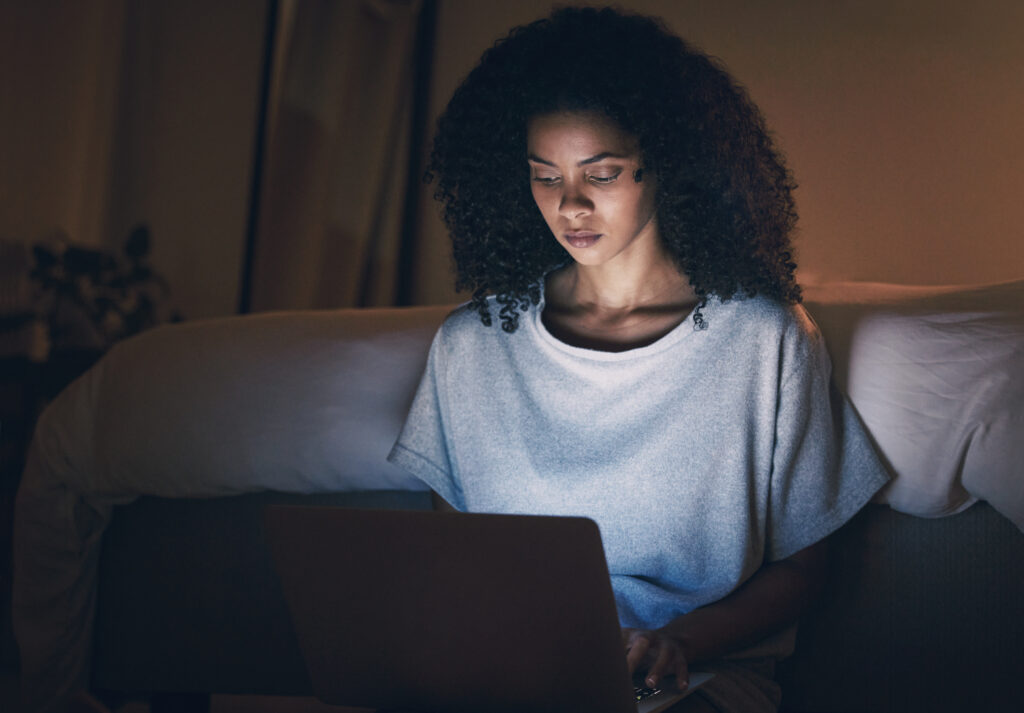 laptop-sofa-and-woman-typing-at-night-for-website-2023-11-27-04-53-57-utc